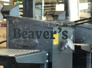 Picture of logo on a door that says "Welcome to the Beaver's Store"