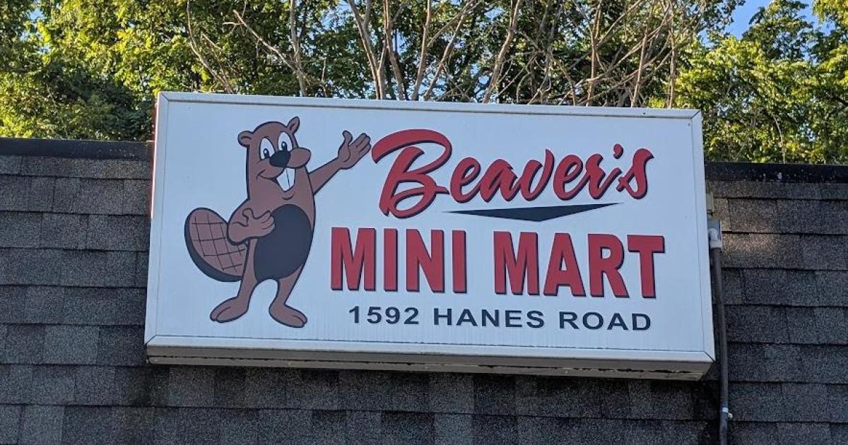 Picture of a sign on a building with a beaver and the words Beaver's Mini Mart